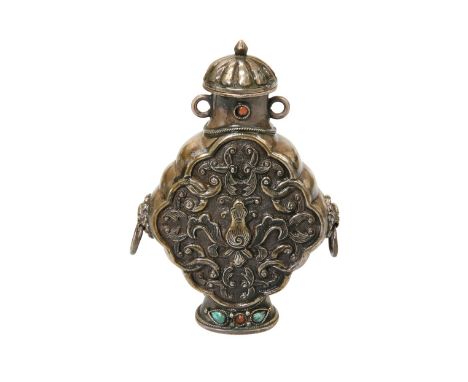 A TIBETAN WHITE METAL SNUFF BOTTLE, set with turquoise and coral stones, the sides with ring handles. 8cm, 1.9 troy ouncesIn 