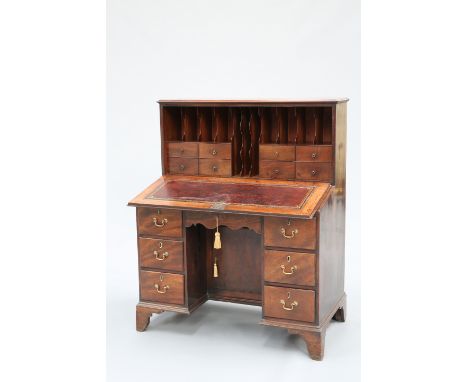 A GEORGE III MAHOGANY FALL-FRONT DESK, the moulded rectangular top above a fall-front with solid brass escutcheon, opening to