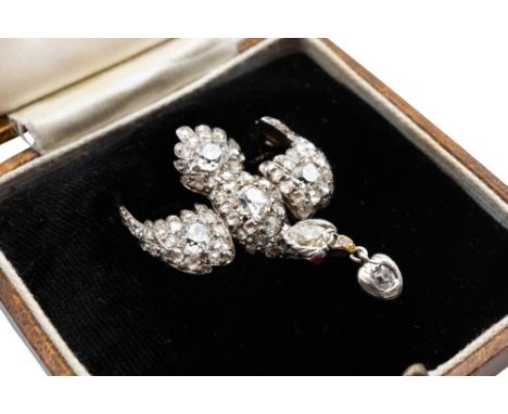 A 19TH CENTURY 'SAINT ESPRIT' BROOCH / PENDANTDesigned as a dove in flight, the body and wings set throughout with cushion an