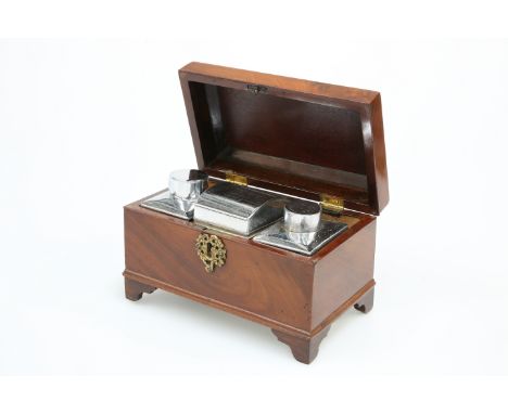 A GEORGE III MAHOGANY TEA CADDY, the hinged rectangular lid opening to reveal a pair of metal lidded canisters and a covered 