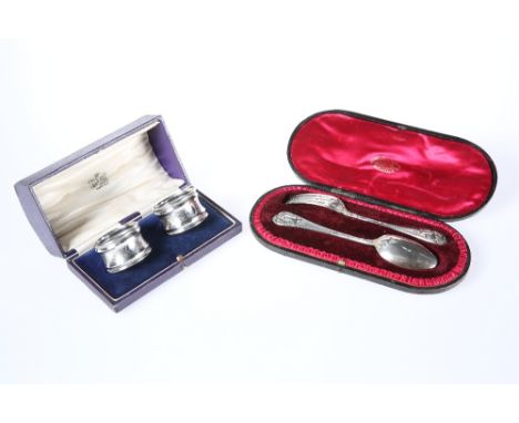 A CASED PAIR OF SILVER NAPKIN RINGS, BIRMINGHAM 1919, the waisted rings with engine-turned decoration; together with A CASED 
