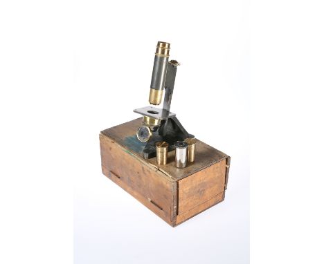 A LACQUERED BRASS MICROSCOPE, BY R &amp; J BECK, LONDON, no. 29915, with lenses and slides. 26cm