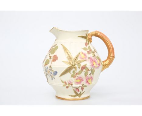 A ROYAL WORCESTER BLUSH IVORY JUG, shape no. 1185, date code for 1887,&nbsp;with bamboo moulded handles and decorated with sc