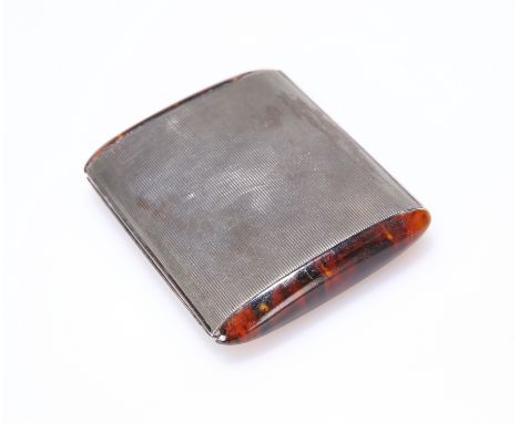 AN ART DECO SILVER AND TORTOISESHELL COMPACT, of navette section with rounded ends, the silver engine turned, stamped marks i