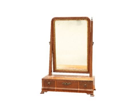 A GEORGE III MAHOGANY TOILET MIRROR, the rectangular mirror swivelling between tapering uprights with brass urn finials, the 