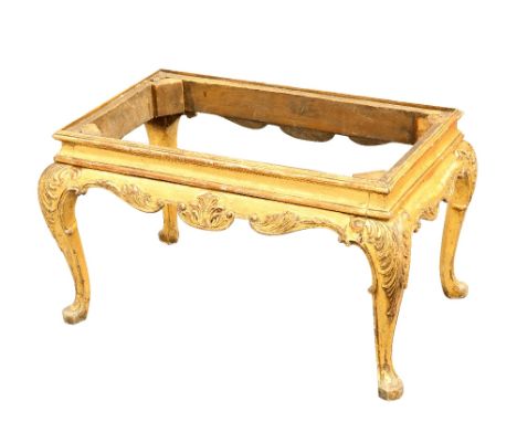 A CHIPPENDALE STYLE GILTWOOD STOOL, rectangular, raised on leaf carved cabriole legs. 75cm long, 47cm wide