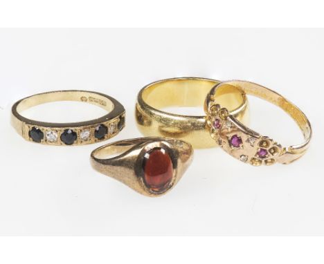 A COLLECTION OF FOUR YELLOW GOLD RINGS to include a 9ct garnet set signet ring, stamped 375, ring size K; a 15ct ruby set rin