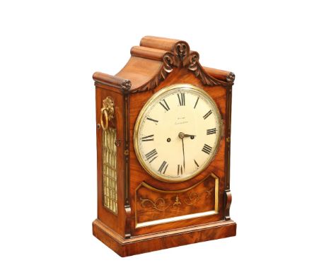 A REGENCY BRASS-INLAID MAHOGANY DOUBLE FUSEE BRACKET CLOCK, the case with leaf carving to the clustered arch top, the 8-inch 