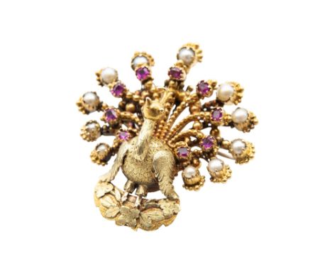 A SEED PEARL AND RUBY PEACOCK BROOCH The beaded tail feathers capped by cushion-shaped rubies and seed pearls, length 3.5cm. 