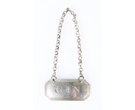 A GEORGE IV SILVER "GIN" BOTTLE LABEL, GEORGE KNIGHT, LONDON 1823, with reeded border. 4.2cm by 1.9cmThe marks are clear. The