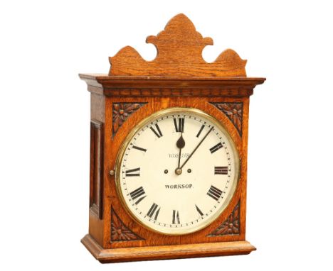 AN OAK STRIKING WALL CLOCK, SIGNED WHEELER, WORKSOP, CIRCA 1880, front corners with carved floral decoration, side doors, 12-