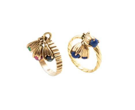 A PAIR OF GEM-SET TASSEL RINGS, BY TIFFANY &amp; CO, CIRCA 1994 1st: The twisted 18 carat gold band suspending three tassels 