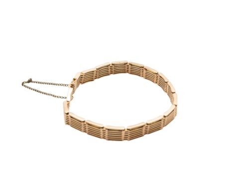A GATE-LINK BRACELETComposed of polished gate-links, clasp stamped 15, length 20.0cm. Gross weight approx. 25.9 grams.General