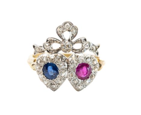 A SAPPHIRE, RUBY AND DIAMOND DOUBLE-HEART RINGDesigned as a pair of conjoined hearts, each respectively set with a circular-c