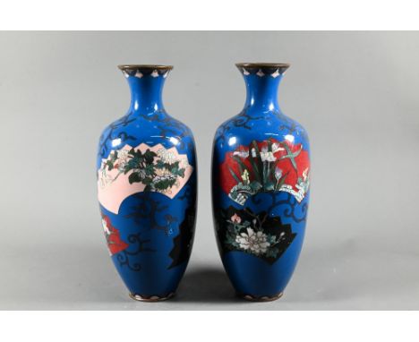 A pair of late 19th century Japanese cloisonne baluster vases, Meiji period (1868-1912) each decorated with flowers and butte