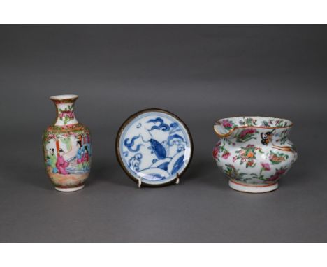 A 19th century Chinese Canton famille rose jug painted in polychrome enamels with birds, butterflies and flowers (missing han