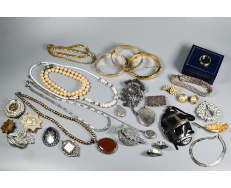 A collection of vintage and later costume jewellery including three gilt metal bangles, brooches, earrings etc  