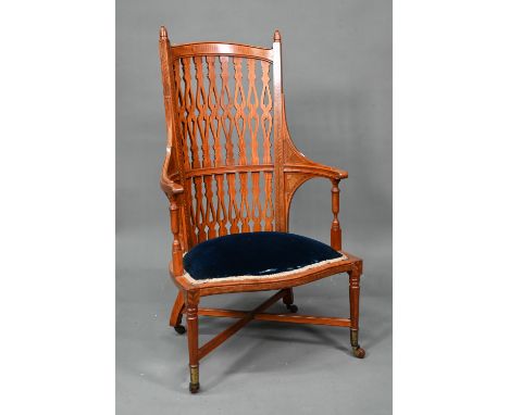 A Victorian Sheraton style inlaid satinwood chair, with fret cut piered spats over a fabric panelled serpentine seat, on bras