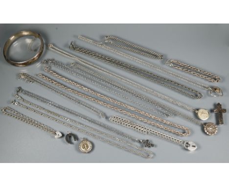 A small collection of silver and white metal jewellery including oval half-hinged bangle, St Christopher, chains, bracelets, 