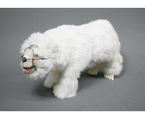 A scarce Roullet et Decamps automaton polar bear with white fur and wire muzzle, 34 x 18cm; walks along swaying his head  
