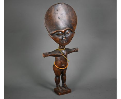 A vintage West African Acna'ba (fertility) doll with traditional broad head and outstretched arms, 40 cm, strung with fine gl