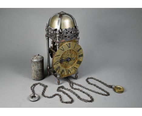 A 17th century brass and steel lantern clock, with verge escapement, the 16 cm dia. brass dial with single hand and striking 