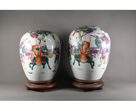 A pair of 19th century Chinese famille rose ovoid vases with covers (missing finials) painted in polychrome enamel with a pro