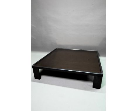 Luigi Massoni (1930-2013) an Italian brown leather framed smoked glass coffee table for Poltrona Frau, 115 cm x 115 cm x 27 c