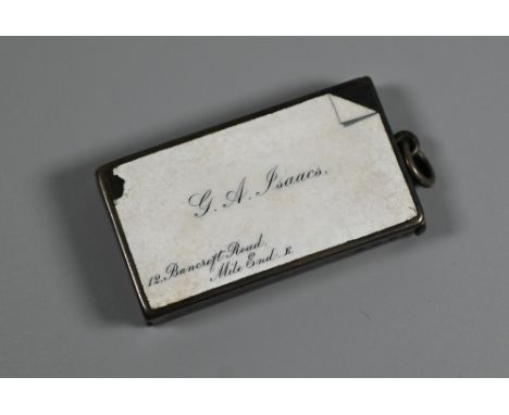 A Victorian novelty silver and enamel vesta case, decorated as a visiting card for 'GA Isaacs, 12 Bancroft Rd, Mile End, E', 