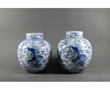 A pair of 19th century Chinese blue and white ginger jars and covers, each painted in rich tones of underglaze blue with four