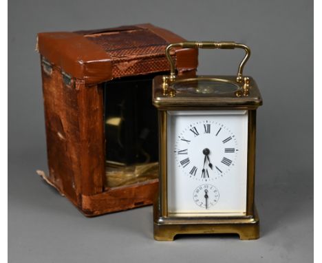 An antique brass carriage clock c/w leather travel case case  