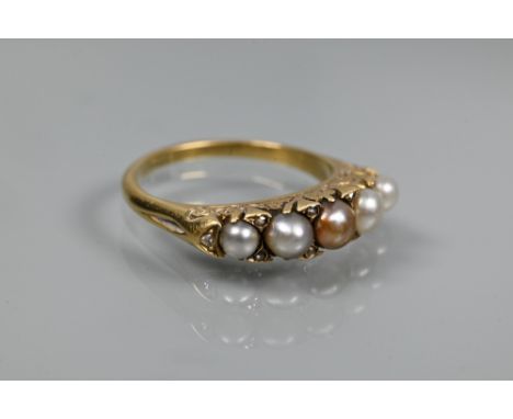 A Victorian pearl and diamond set ring, the five graduated pearls of differing colours, with rose cut diamonds between, carve