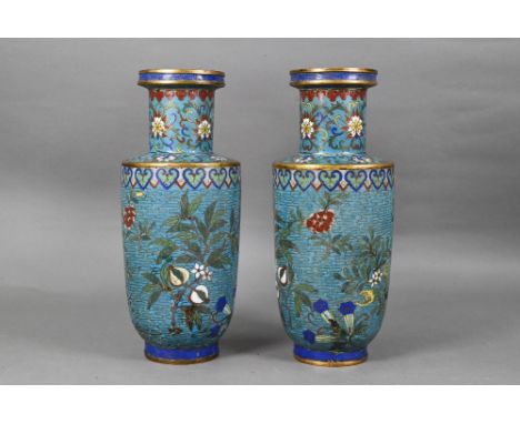 A pair of 19th century Chinese cloisonne on brass rouleau vases decorated in polychrome enamels with flowering and fruiting b