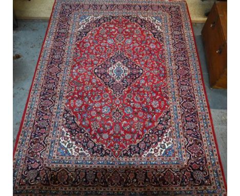 A Persian Kashan red ground carpet, with traditional stylised floral design, 348 cm x 248 cm  good even pile, clean, no losse