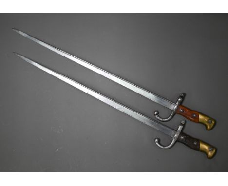 Two 19th century French sabre bayonets, with 52 cm steel blades, marked St Etienne 1877/78 (no scabbard) to/w a small kukri (