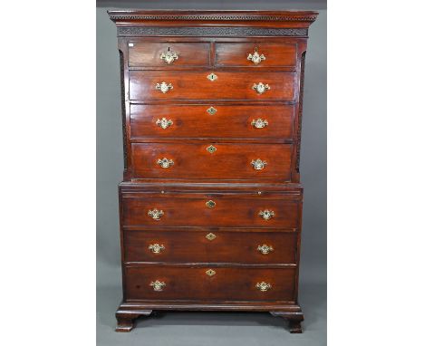 A Georgian mahogany chest on chest, the blind fret moulded cornice over two short and three long graduated drawers flanked co