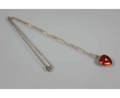 A Victorian red enamel locket pendant, the heart-shaped locket with guilloche red enamel, set with an old-cut diamond, openin