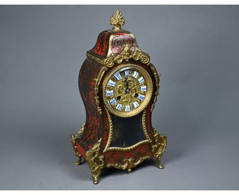 An antique French gilt metal mounted boulle mantel clock, the 8-day Rollin movement with gilt dial and blue-white porcelain t