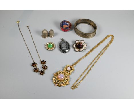 A small quantity of costume and other jewellery including half-hinged oval bangle, two silver thimbles, paste-set jewellery, 