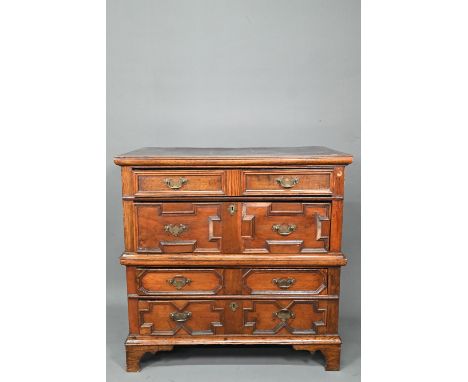 A Jacobean and later oak chest of 4 long drawers in two sections, the drawers with applied geometric mouldings, raised on sha