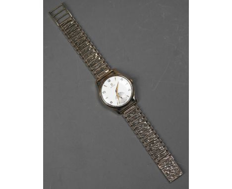 An Omega 9ct gold wristwatch, the crown wind movement within a 32 cm dia. case, with champagne dial incorporating a secondary
