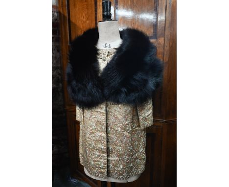 A vintage black fur shoulder cape to/w a gold brocade jacket featuring small floral sprigs, with mandarin type collar and but