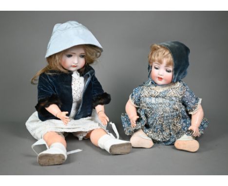 A German bisque-headed girl doll with closing blue eyes and open mouth with four teeth, on jointed composite body, 50 cm, to/