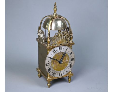 A contemporary miniature brass lantern clock, the 8-day movement striking the hours and half hours on a bell, 25 cm h  