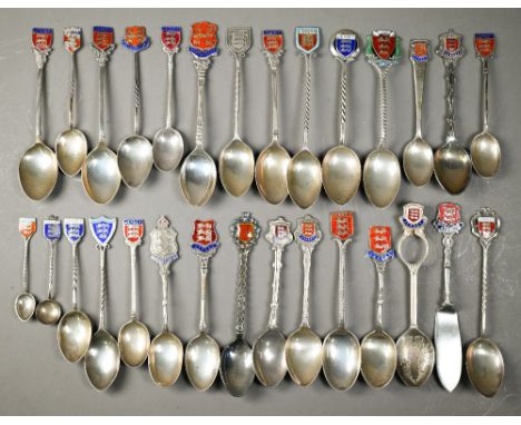 Twenty four silver and enamel Jersey and Guernsey souvenir spoons, 7.8oz gross weight, to/w four ep spoons and a butter knife