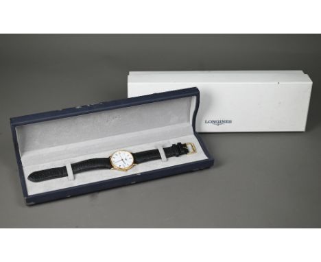 A gents Longines 18ct gold cased (33 mm) wristwatch model L7 990 6, the white enamel dial with date aperture, fitted with lea
