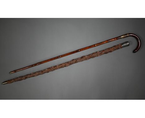 A late 19th century sword stick with hoop handle within a bamboo scabbard to/w an oriental silver topped knobbled cane, 90 cm