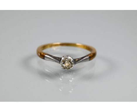 A single stone diamond ring, the old cut circular diamond in yellow and white metal shank stamped 18ct and plat, size N  Claw