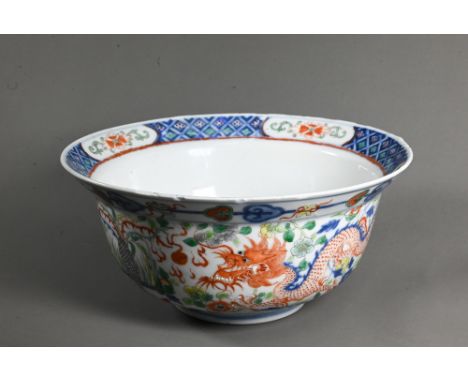 A late 19th or early 20th century (Kangxi Revival) Chinese wucai 'dragon and phoenix' bowl, painted in underglaze blue and po