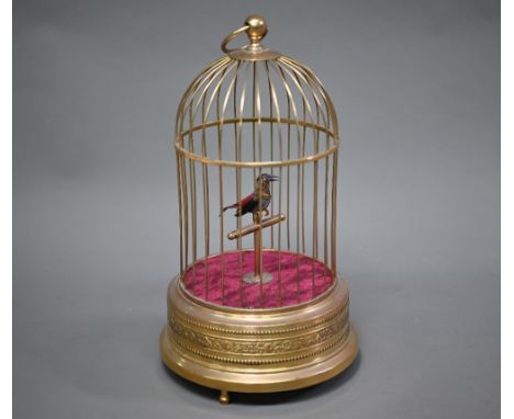 A singing bird clockwork automaton in gilt brass cage, 28 cm high  